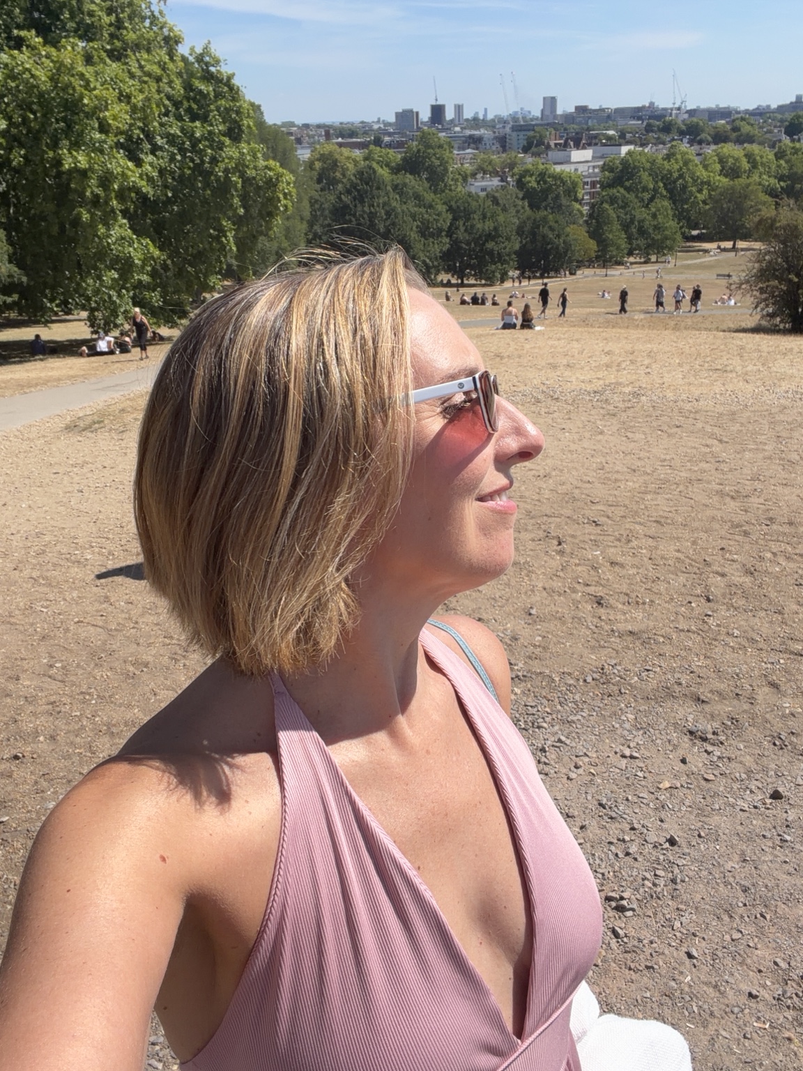 Heather Black looking out over a park in London